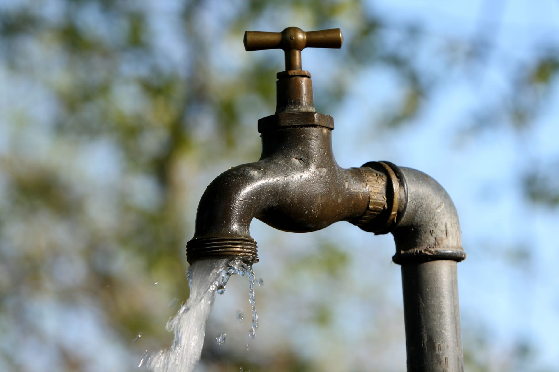Old outdoor tap running