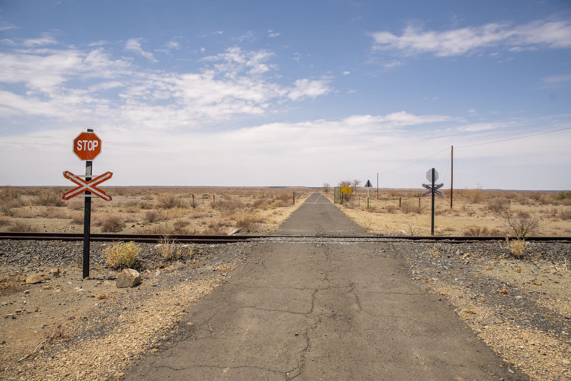 Stop sign at rail crossing in outback