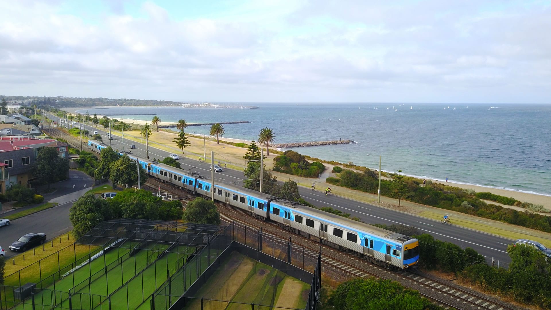 Train along coast beside beach
