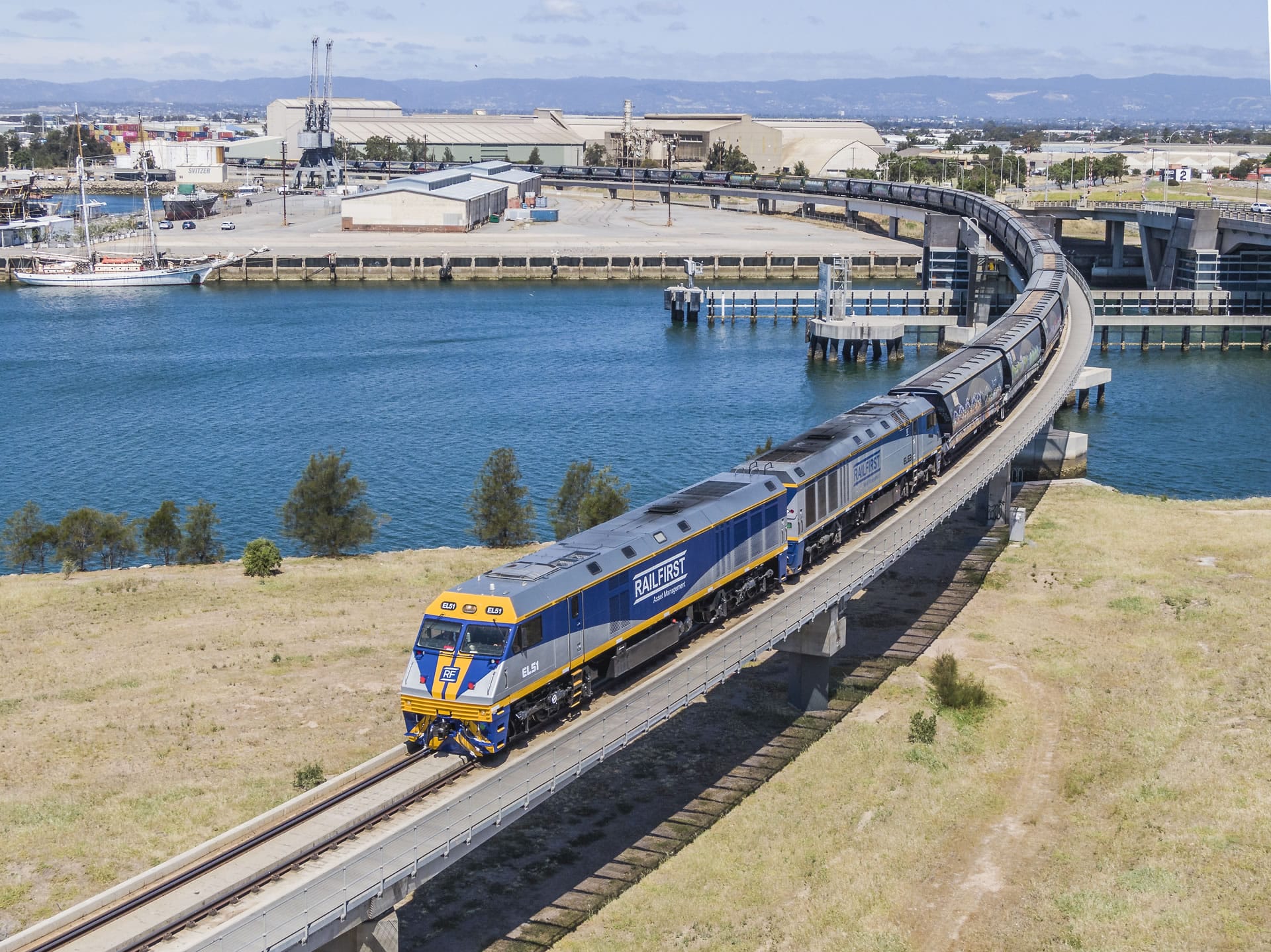 Freight train by harbour and port