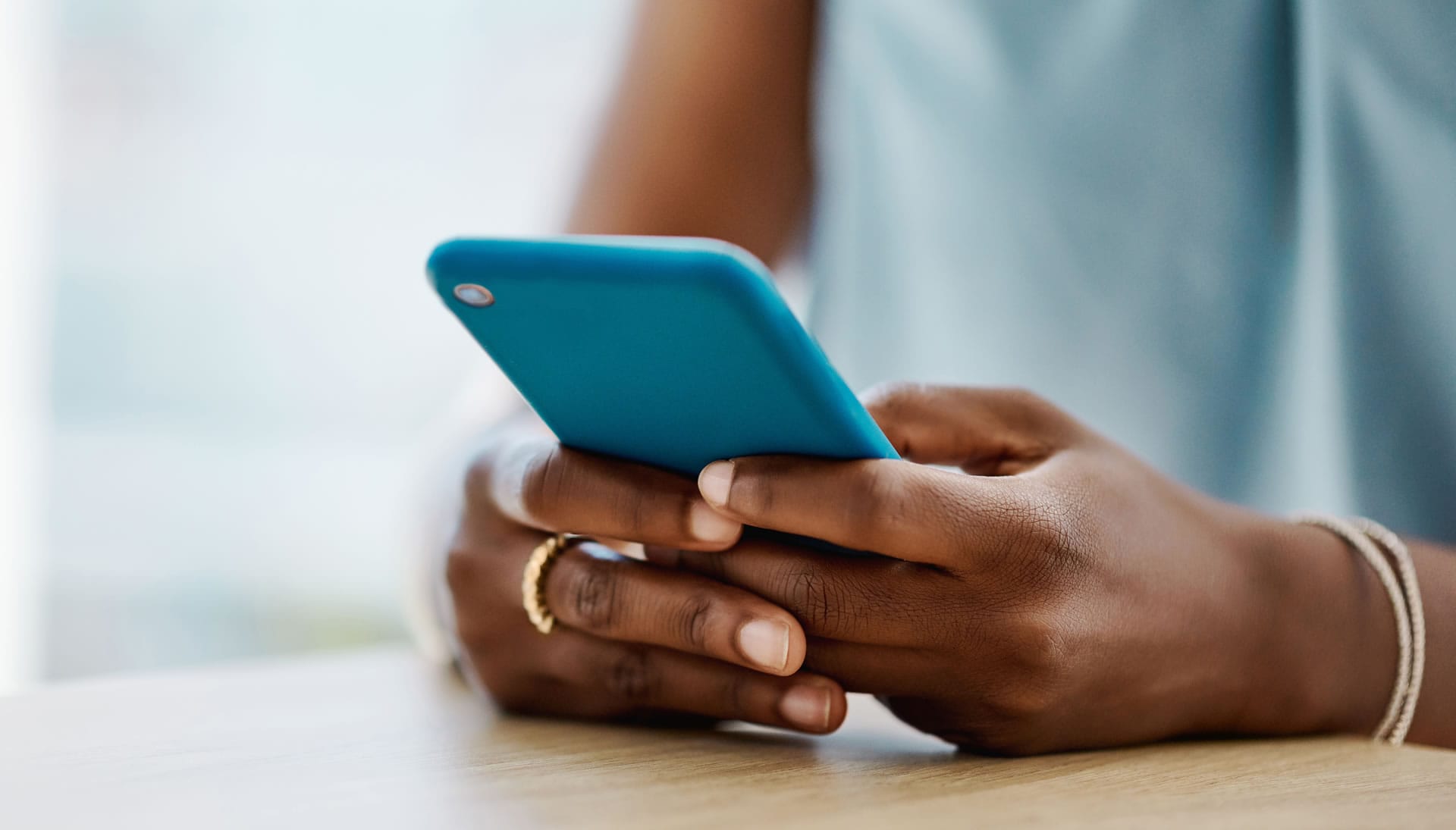 Hands holding smartphone