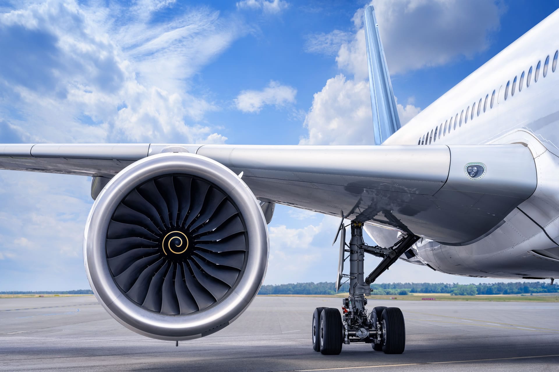 Jet engine and wing on tarmac