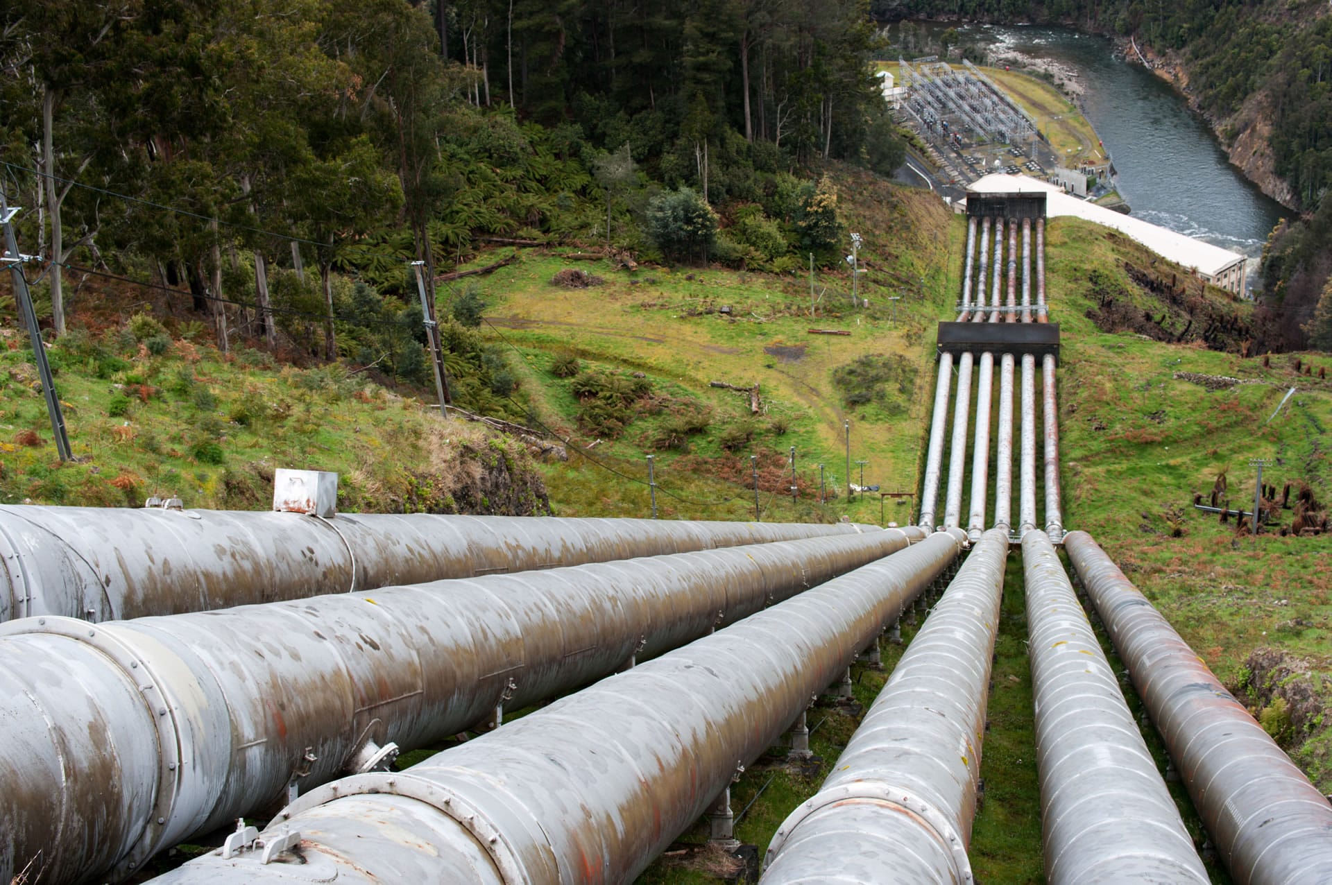 Hydro penstock pipes down hill