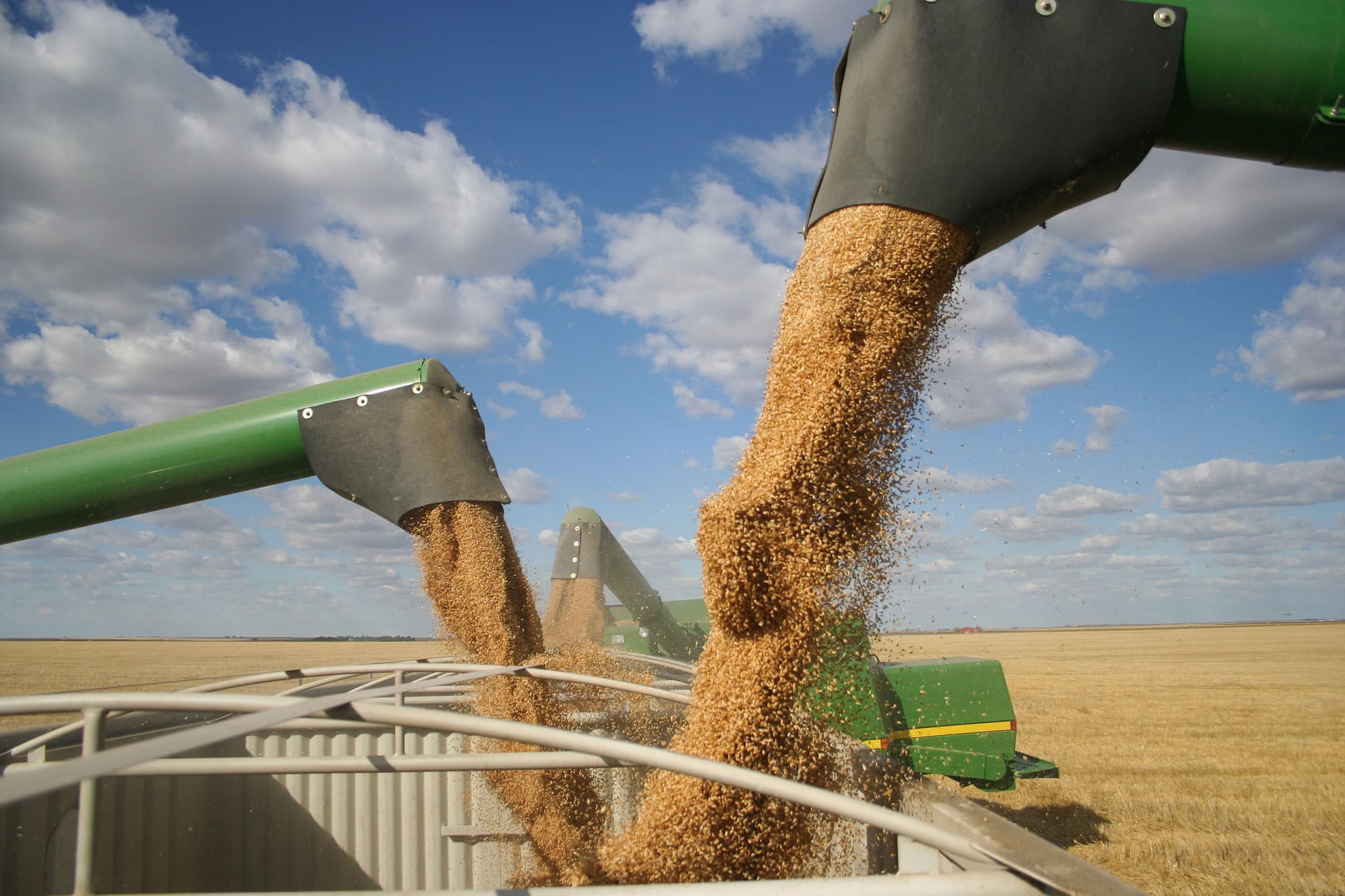 Grain auger loading truck