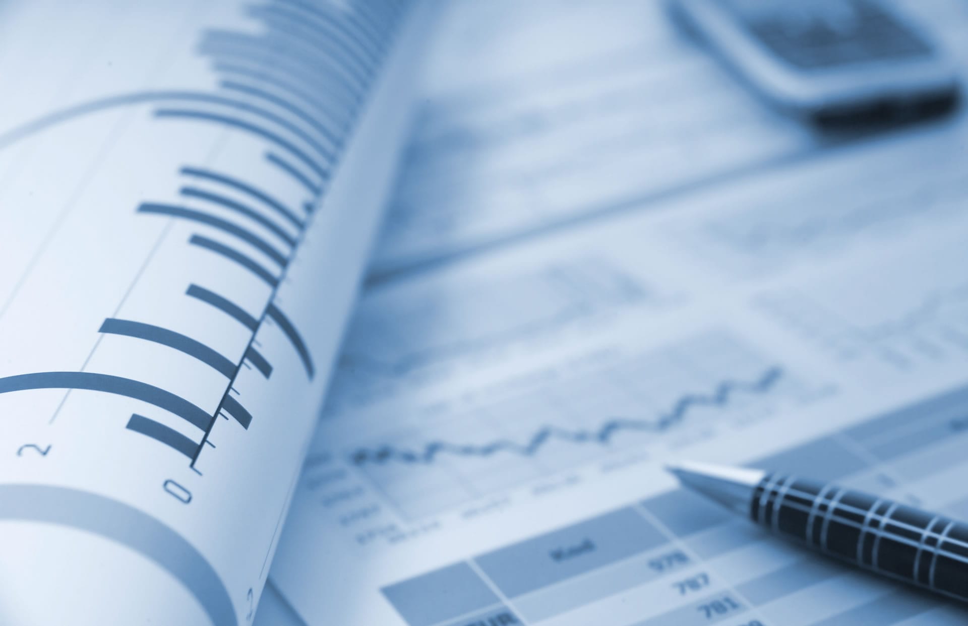 Financial charts and pen